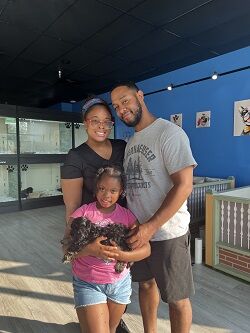 Happy family with their new Pettito puppy